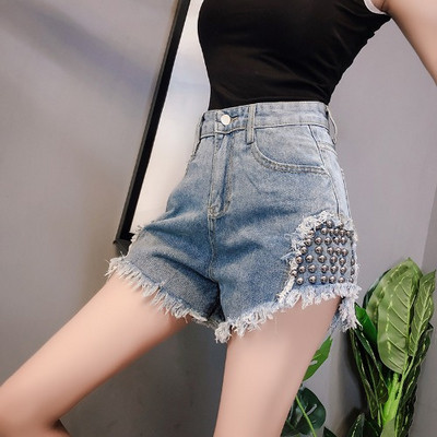 Uus kõrge vöökoha ja metallist neetidega teksapükste mudel