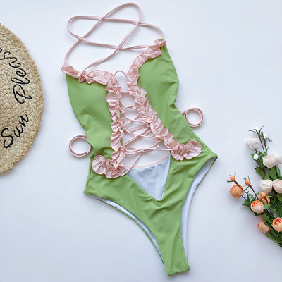 Täielik väljalõigetega ujumistrikoo, paljas selg ja lipsud