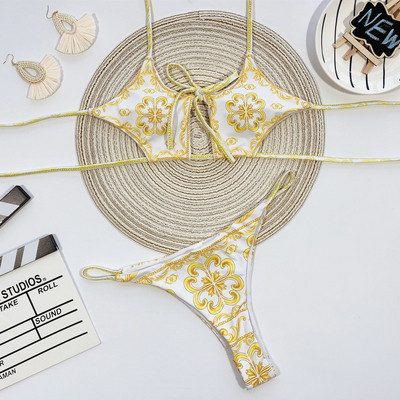 Praegune kaheosaline lipsudega ja erinevate värvimustritega ujumistrikoo