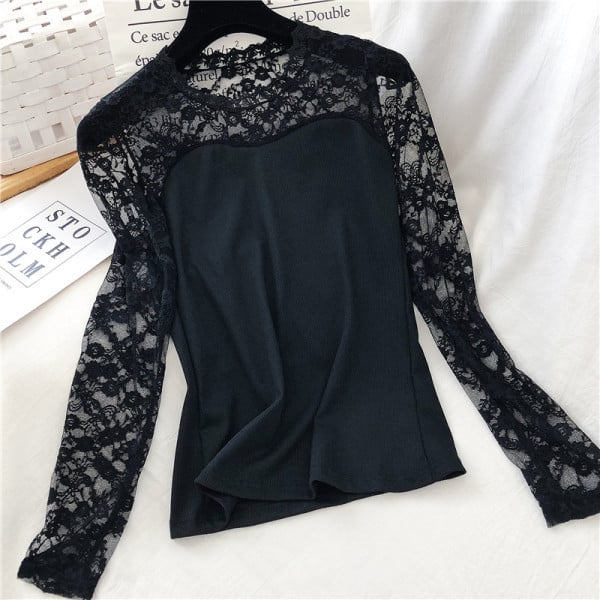 Moderna ženska bluza u bijeloj i crnoj boji sa ovalnim dekolteom