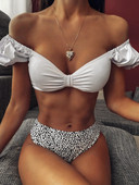 Naiste kaheosaline kõrge vöökoha ja allalastud varrukatega ujumistrikoo