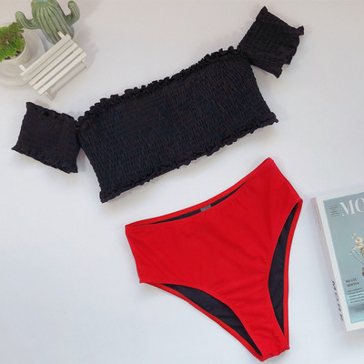 Uus ujumistrikoo mudel elastse musta ülaosa ja punase allosaga