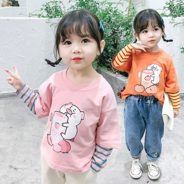 Laisva vaikiška palaidinė su aplikacijomis ir apvalia iškirpte mergaitėms