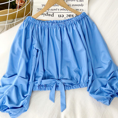 Moodne naiste lipsudega pluus sinist, valget ja kollast värvi