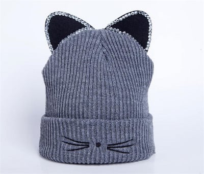 Naiste kootud müts 3D elemendi ja kivikestega