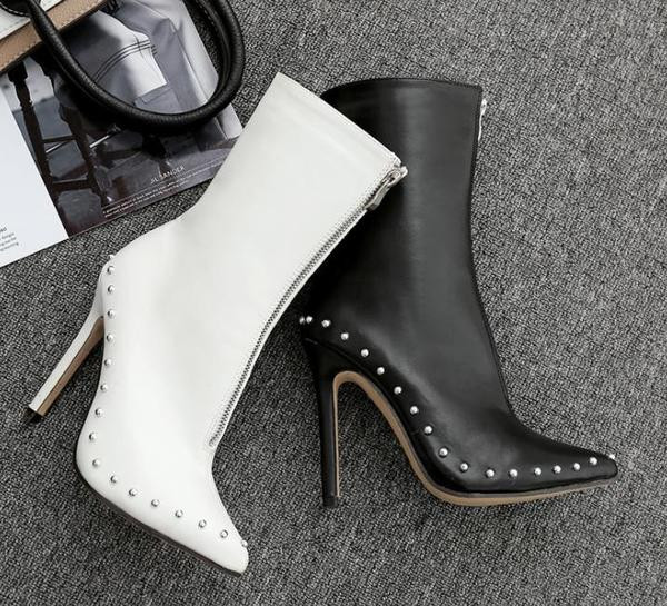 Moodsad kunstnahast õhukese kontsa ja lukuga naiste saapad - terava otsaga mudel