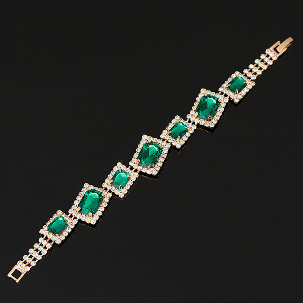 Elegantiška moteriška auksinė apyrankė su akmenukais