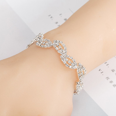 Elegant women`s multi-layered bracelet with stones