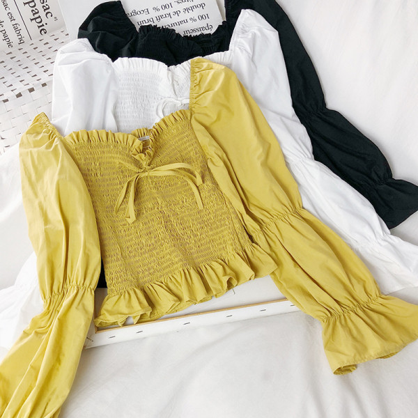 Naiste kollane, must ja valge lipsudega pluus