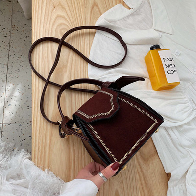 Väike naiste retrokott tikandi ja seemisnahaga