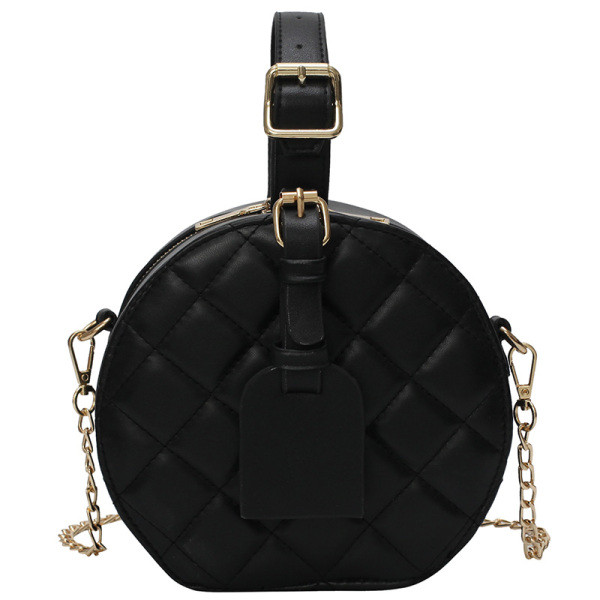 Kerek női táska rövid és hosszú füllel, fém elemekkel