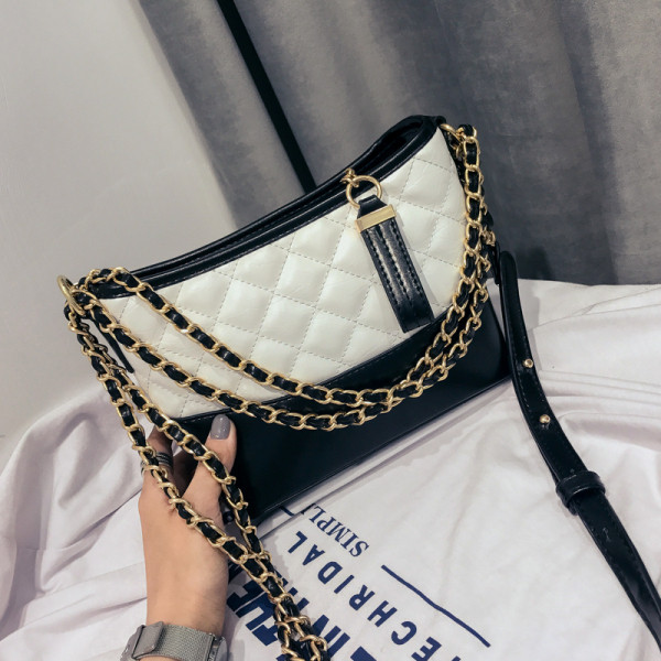 Kahevärviline metallist elemendiga lühikese ja pika sangaga naistekott