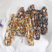 Kandilise kaelusega, lipsude ja lillemustriga vabaaja naiste pluus