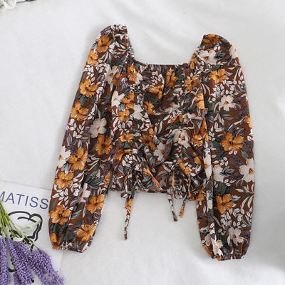 Kandilise kaelusega, lipsude ja lillemustriga vabaaja naiste pluus