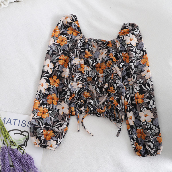 Kandilise kaelusega, lipsude ja lillemustriga vabaaja naiste pluus