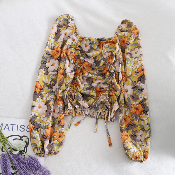 Kandilise kaelusega, lipsude ja lillemustriga vabaaja naiste pluus