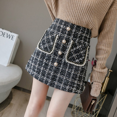 Elegantna ženska jesensko-zimska suknja s visokim strukom i džepovima