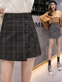 Naiste kõrge vöökoha ja nööpidega ruuduline seelik