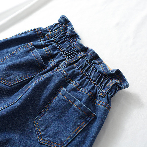 Uue mudeli kõrge vöökoha ja nööpidega naiste teksaseelik