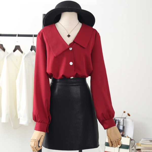 Uue mudeli nööpide, pikkade varrukate ja spitsikaelusega särk