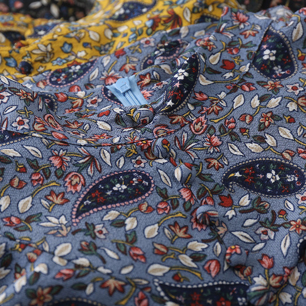 Naiste polokrae, laiade varrukate ja lillemotiividega särk