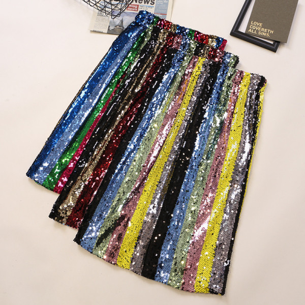 Värviline naiste keskmise pikkusega, kõrge vöökoha ja litritega seelik