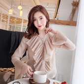 Moodne naiste särk nööpide, pikkade varrukate ja lokkidega