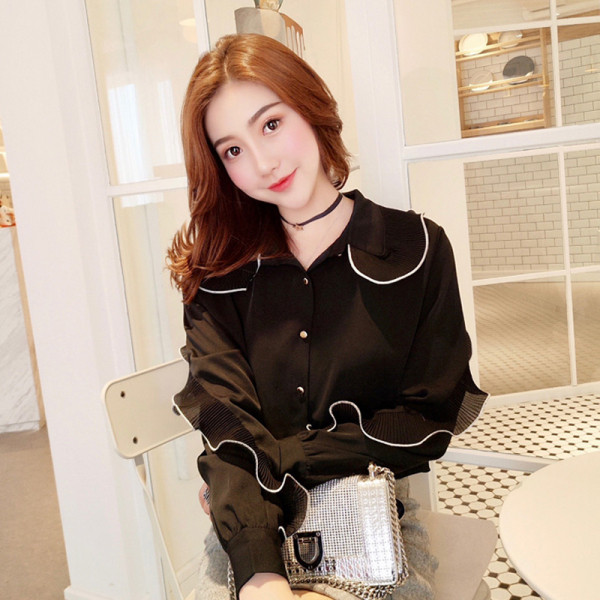 Stiilne nööpide ja pikkade varrukatega naiste särk