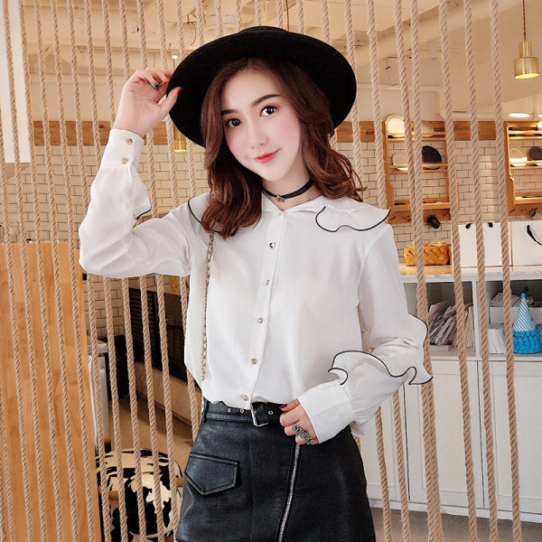 Stiilne nööpide ja pikkade varrukatega naiste särk