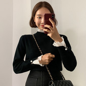 Naiste moodne pärlitega pluus varrukatel ja kõrge kaelusega