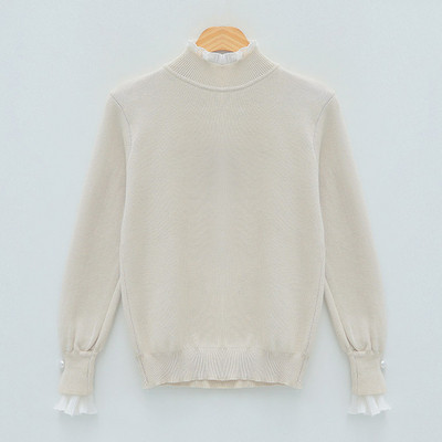 Naiste moodne pärlitega pluus varrukatel ja kõrge kaelusega