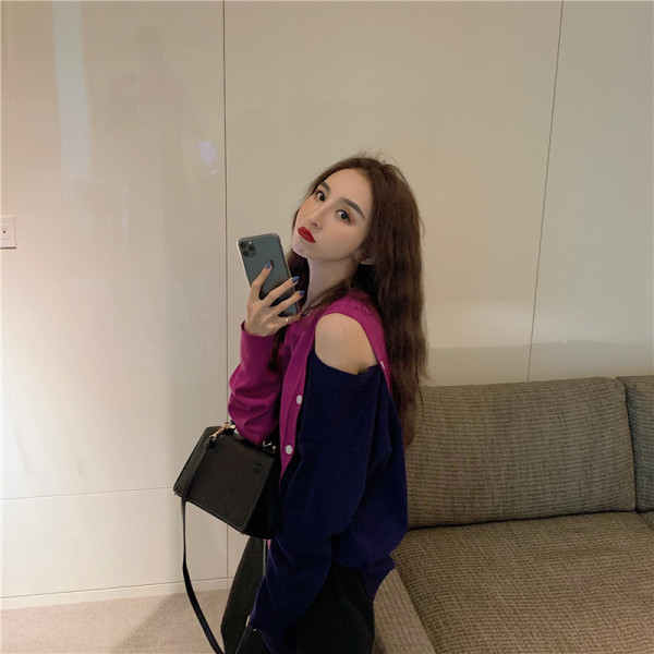 Kéttónusú női blúz leejtett ujjakkal és gombokkal