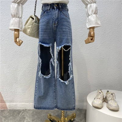 Praegune naiste teksapükste lai mudel kõrge vöökoha ja rebenenud motiividega