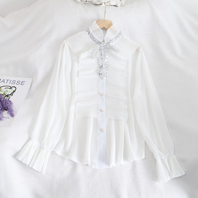 Naiste lipsude ja nööpidega šifoonist särk