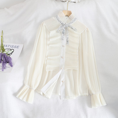 Naiste lipsude ja nööpidega šifoonist särk