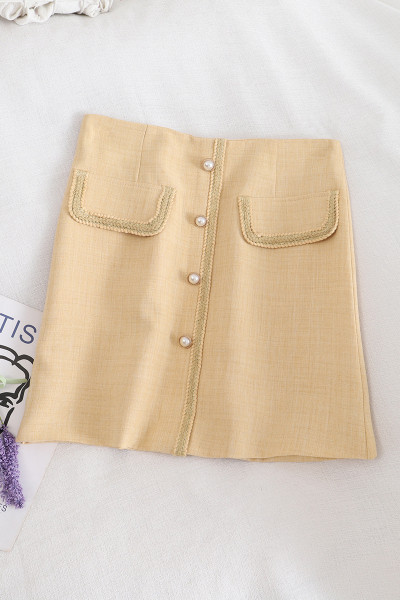 Aktuelna ženska suknja na dugmad i visokog struka