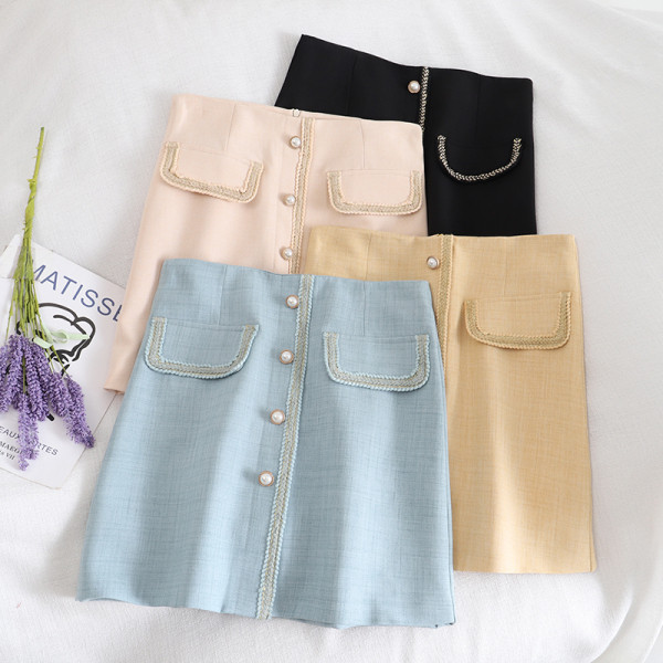 Aktuelna ženska suknja na dugmad i visokog struka