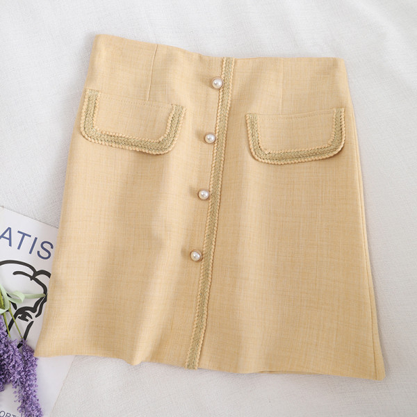 Aktuelna ženska suknja na dugmad i visokog struka