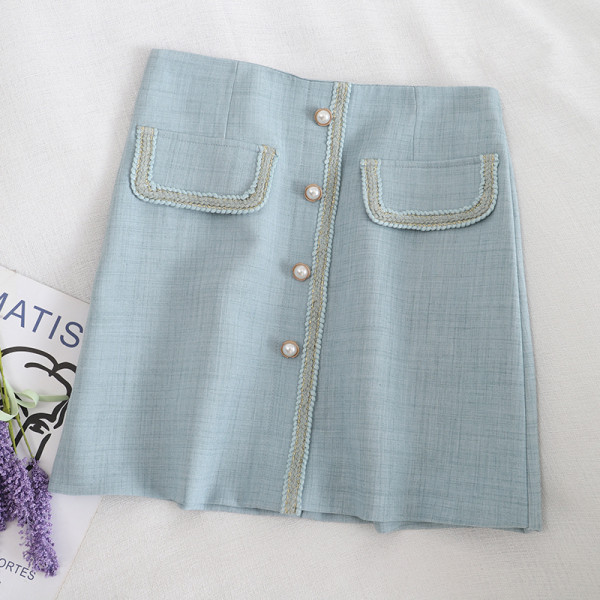 Aktuelna ženska suknja na dugmad i visokog struka