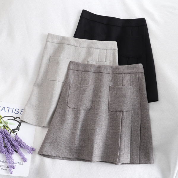 Lühike naiste seelik taskute ja kõrge vöökohaga