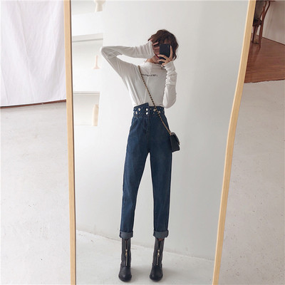 Moodsad kõrge vöökoha ja metallelementidega naiste teksad