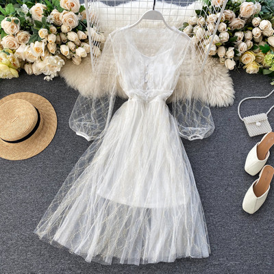 Új modell szabású, közepes hosszúságú, átlátszó ujjú női ruha