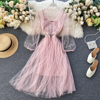 Új modell szabású, közepes hosszúságú, átlátszó ujjú női ruha