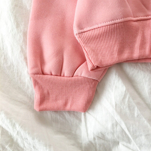 Rózsaszín női blúz kerek nyakkivágással és rátéttel