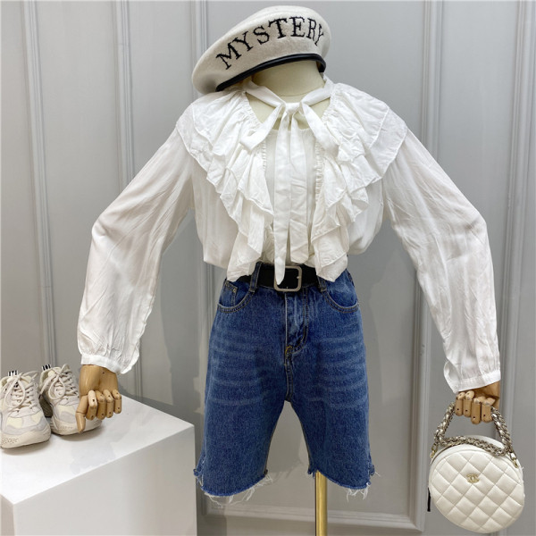 Modern női ing szalaggal és hosszú ujjal