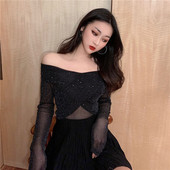 Naiste võrgust pluus, millel on langenud varrukad ja litrid