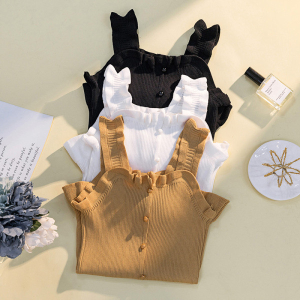 Suur laiade rihmade ja nööpidega naiste topp