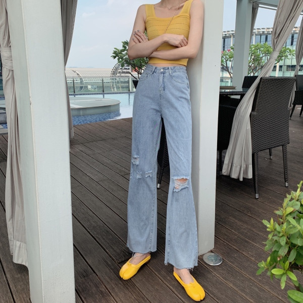 Laiad rebenenud motiividega ja kõrge vöökohaga naiste teksad