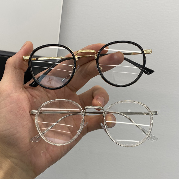 Stiilsed ümara kuju ja metallraamiga naiste prillid