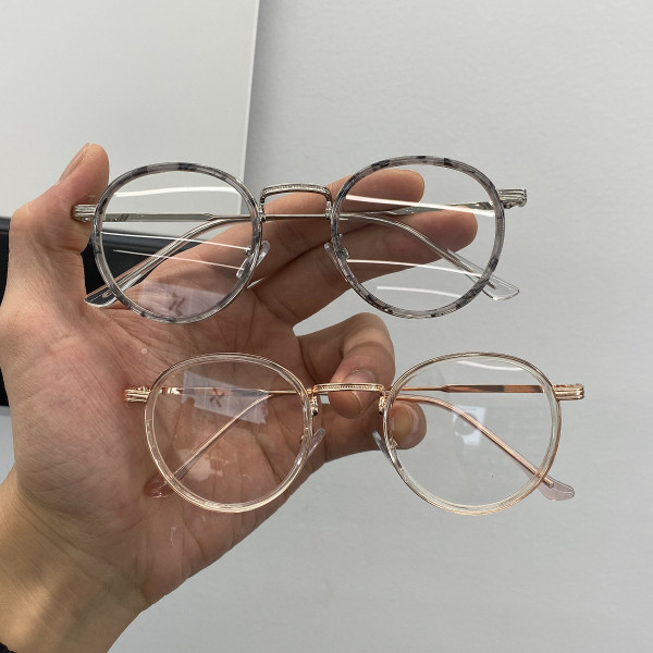 Stiilsed ümara kuju ja metallraamiga naiste prillid